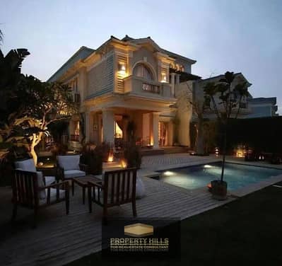 Luxury villa immediately finished with a swimming pool in Mountain View Prime Auction in a compound with all services next to AUC, Patio 3, The Waterway, Zizinia, Hayah Residence, and Grand Residence