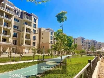 Own an apartment with an open view of the prime landscaped location in front of Madinaty and near AUC