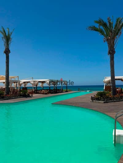 Chalet 1 bedroom, fully finished with air conditioners, in Ras El Hekma, for sale, directly on the lagoon, inside Naia Bay.