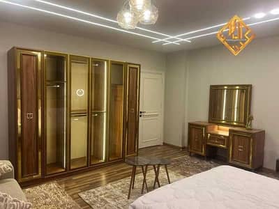 Apartment for sale in Mohandessin, at the intersection of Syria Street and Geziret Al-Arab Street; ultra-super-lux finish. Code A016.
