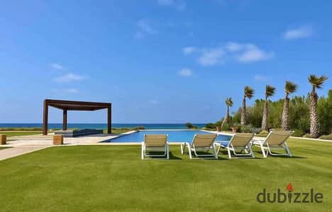 Chalet at half price in front of the first international airport in Ras Al Hikma with hotel finishing and a direct sea view