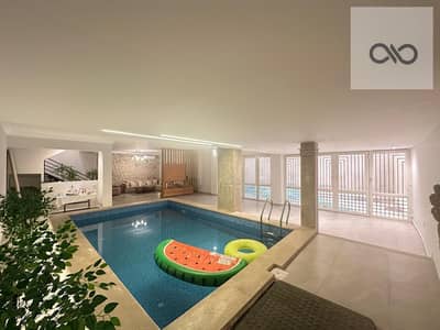 Duplex apartment for sale, ultra super lux finish in Al Yasmine 4 overlooking a garden square, with an area of approximately 450 m² built, ground + basement, with a swimming pool and 2 gardens 150 m to