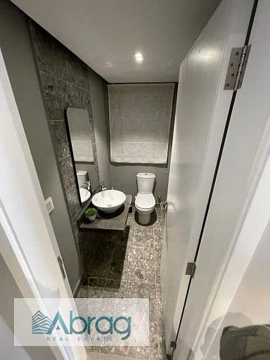 Studio for sale, fully finished and air-conditioned, in Village West Compound, Sheikh Zayed.