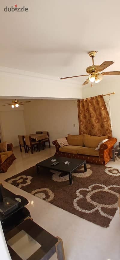 Furnished apartment with a roof terrace for rent in a villa in Al-Yasmeen 1; prime location with a garden view.