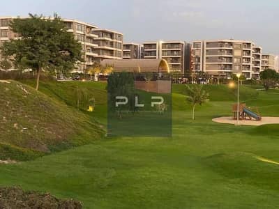 Ground-floor apartment with a garden at the lowest price and with payment facilities, in the Taj City compound, New Cairo.