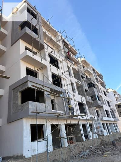 Apartment for sale in Future City, New Cairo, with a down payment of 2,300,000 and installments over 8 years, delivery soon, Marina Heights Compound, wall to wall with Madinaty, minutes from the Suez Road
