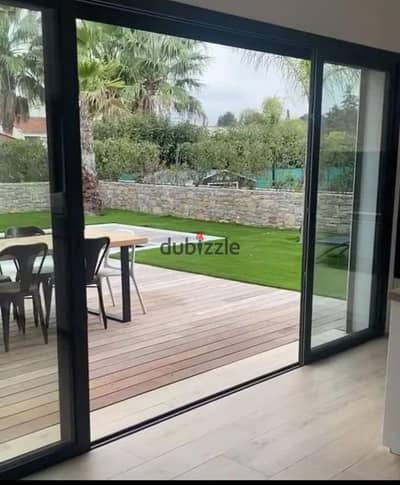Own a villa with 12-year installments facing the largest landscape plot in a compound connecting Fifth Settlement and Mostakbal City near Privado