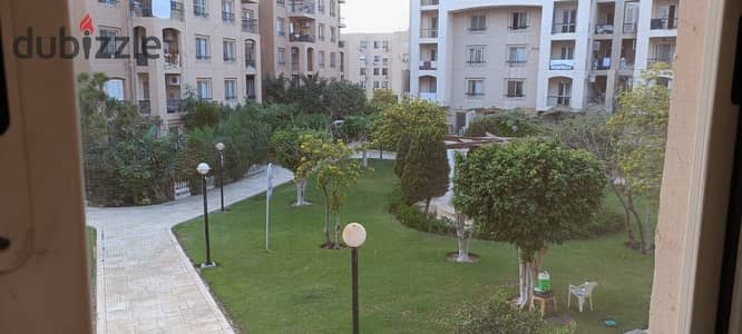 Furnished apartment for rent in Al Rehab, garden view, prime location near Services.