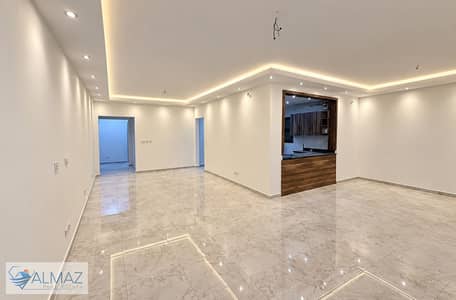 A distinctive, unfurnished 197-square-meter apartment with a kitchen is available for rent in the SODIC Eastown compound, Fifth Settlement