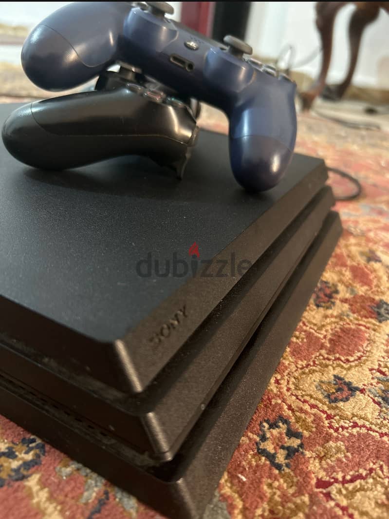 Ps4 pro with two original controllers bought from qatar 2