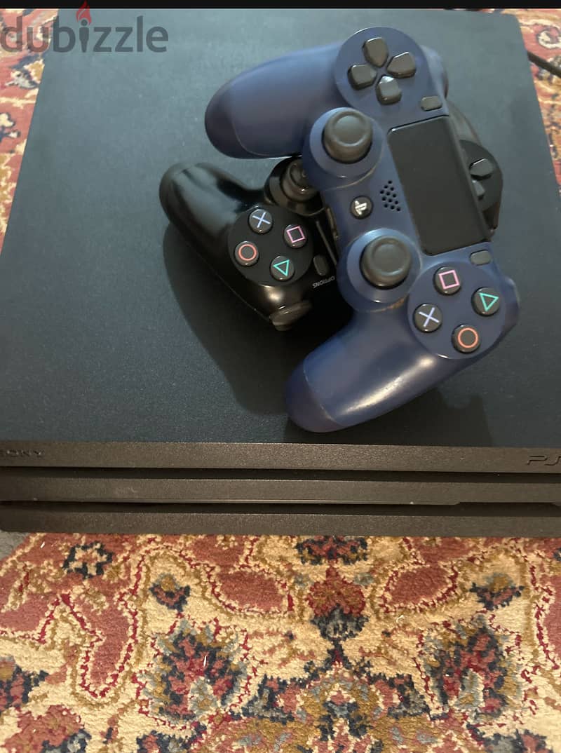 Ps4 pro barely used with two original controllers 1
