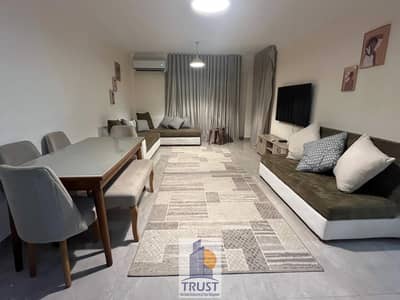 Premium housing in the heart of Sheikh Zayed   Furnished apartment for rent in Zayed Garden 2   130 meters | First floor + Elevator  3 rooms |  2 bathrooms  High-end hotel furniture |  Fully air-conditioned  60-inch screen |  Internet   Very special location 7 minutes from Hyper One 10 minutes from Americana Plaza   Apartment