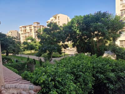 A distinctive apartment for sale in Madinaty with a garden view.