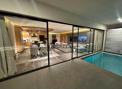 A premium villa for sale in Patio Town – New Cairo, featuring a prime location next to AUC