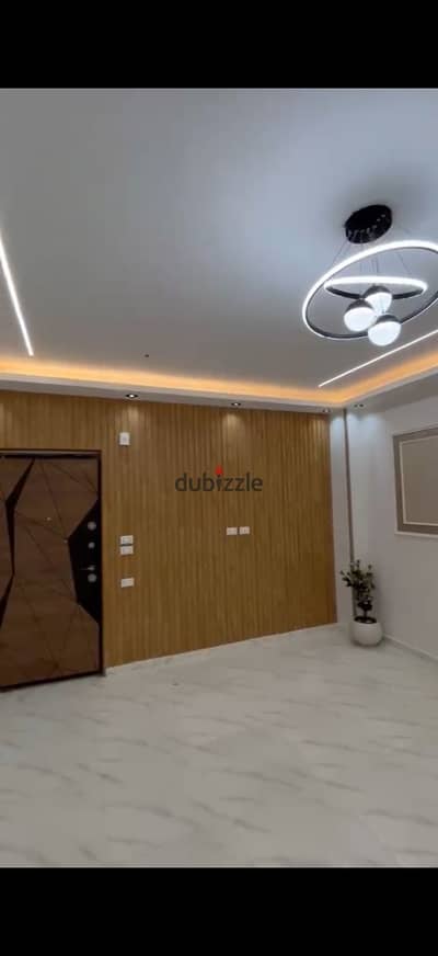 Apartment for sale in Badr City located on the main street, an investment opportunity for residency or rent, comes with a 100-meter garden close to all basic services, ultra-super lux finishing, electricity meter, water meter