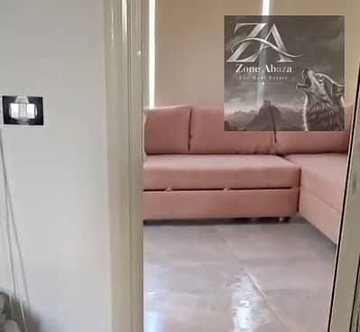 Furnished studio apartment for rent in Stone Residence Compound, Katameya, Cairo, with kitchen and air conditioning.