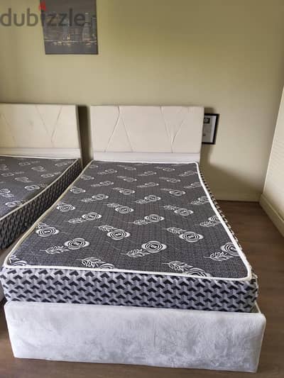 2 single beds and 2 wardrobes