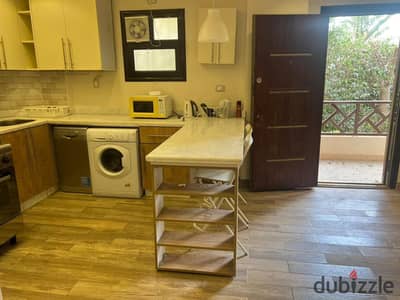 Furnished studio with a garden for rent in Al Rehab; 60 sqm, custom finishes.