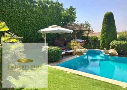 At the lowest price in the market, a ready villa for viewing in the most distinguished compound in Al-Shorouk, minutes from the British University, with a private pool on the Suez Road in front of Madinaty 2 and an open-air mall.