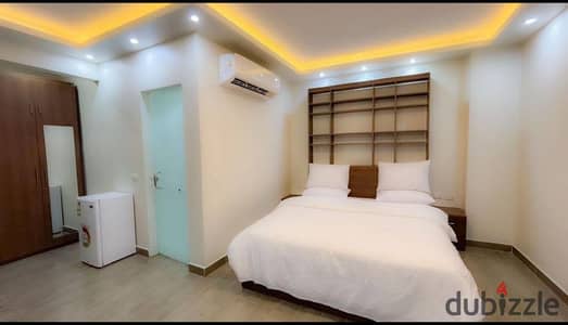 Single Studio for Rent Includes All Services in the Best Place in Sixth of October City, Second District Including Electricity, Water, Gas, Cleaning, Caretaker, Elevator, and Furniture Changed Every Week with Cleaning Every Week, and Laundry Also Covered by the Place, and the Kitchen Separate from the Room as If You Were Living in a Hotel Right Next to You.
