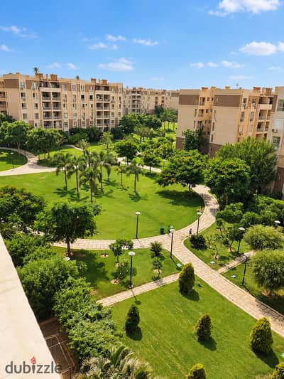 96m² Apartment with Exceptional Finishes & Wide Garden View — First Row on The Spine, Madinaty B7