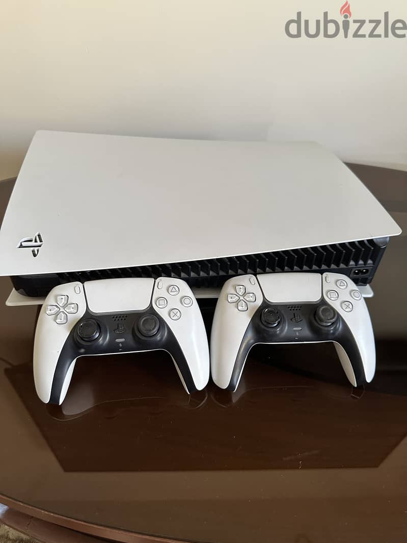 PS5 + 2 controllers and 3 cds 1