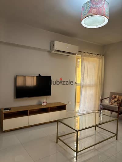 Apartment for sale in the Italian Compound with kitchen and appliances, modern finish, open view in front of the Green River and the fast train