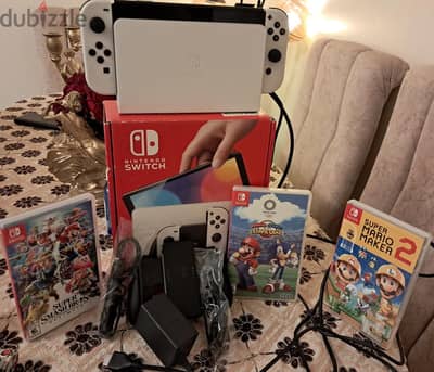 Nintendo switch oled with all accessories and three games