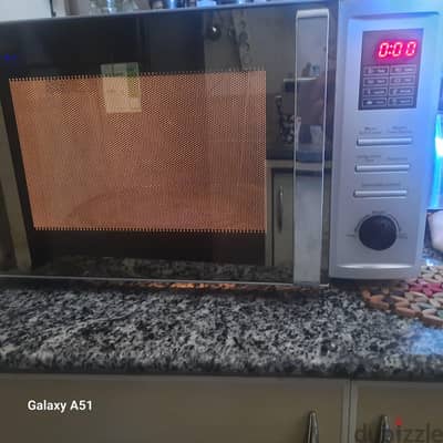 ميكروويف تورنيدو 36 لتر بشواية – MOM-C36BBE-S – حالة ممتازة