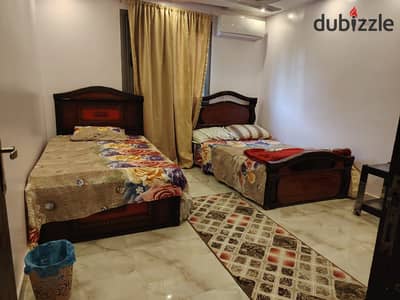 Furnished apartment for rent steps from the Maadi Corniche, Tura and Al-Shorouk Club. Super Lux consists of three bedrooms and a reception, 2 bathrooms, and an air-conditioned kitchen with 2 air conditioners, it has five beds and all amenities, tenth floor, elevator, side Nile view.