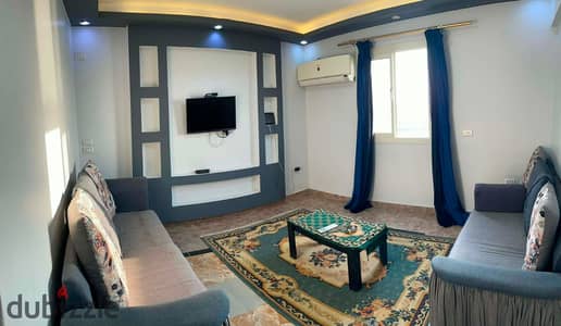 Furnished apartment for rent on the Nile, Maadi Corniche, Tora, consisting of two bedrooms, a reception area, 2 bathrooms, and a fully equipped kitchen with Wi-Fi, 15th floor, elevator