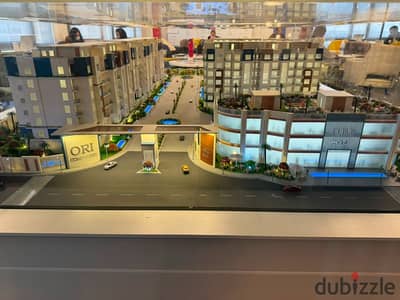 122sqm apartment in ORI Compound, Sheikh Zayed, with 47sqm private garden. 5% down payment, installments up to 9 years. Prime investment.