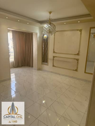 An excellent, unfurnished apartment for rent in Madinaty (B6). It features custom finishes and comes equipped with a kitchen, chandeliers, internet ac