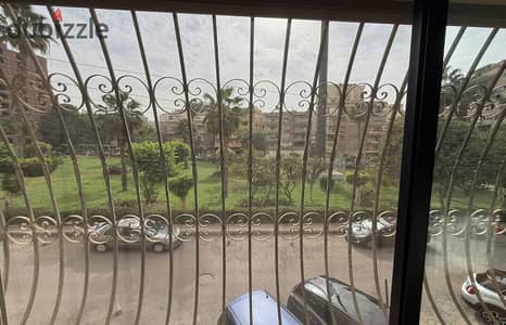 310 sqm apartment for sale in Heliopolis; high-end finishing, 5 rooms, 4 bathrooms, and an open view overlooking a garden.