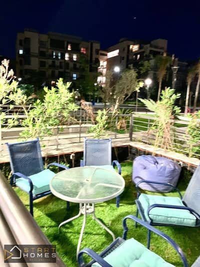 Furnished 100m² ground-floor apartment with a garden for rent in Madinaty (B8); features a garden and a garden view.