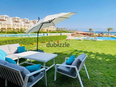 For sale A ground floor chalet Ready To Move with a garden in the Blue Blue resort, Ain Sokhna. Located in a prime spot near the windmills
