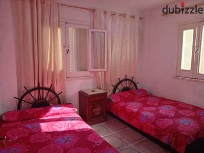 Furnished apartment for annual rent family or bride or student or company 2 bedrooms reception two pieces kitchen bathroom fifth floor upper all services available water and electricity in Alexandria Al-Ajami kilo 21 on Nakheel beach in a very distinguished location