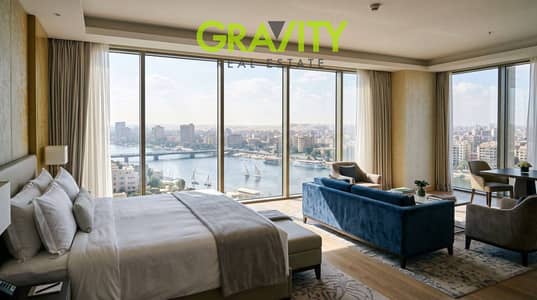 Furnished hotel studio finished with furniture and appliances at the initial offer price with a direct view of the Nile and the Pyramids, your opportunity to invest in partnership with the great artist Mohamed Ramadan