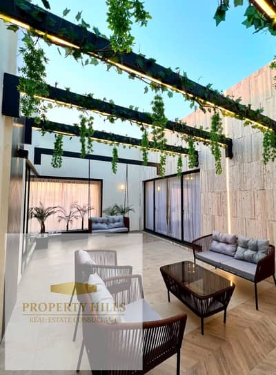 Half-price super-luxury corner townhouse for sale in New Cairo, 5% down, minutes from AUC & SODIC Villette.