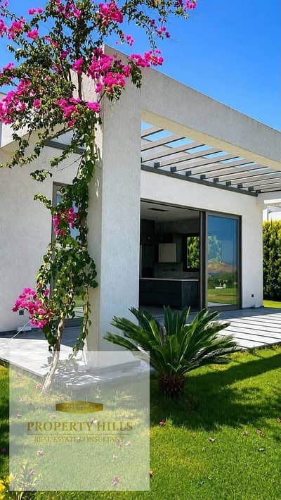 Latest corner villa for sale, immediate delivery, fully finished with air conditioning and kitchen, with a clear view of the sea directly in Ras Al-Hikma