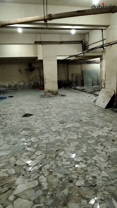 Car garage for sale/ area of 600 meters net located in Maadi