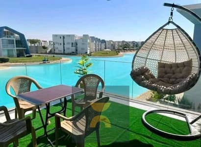 own a two-bedroom chalet with the highest rental yield first row on Crystal Lagoon minutes from Jun Sodic Salt Summer modon Ramla