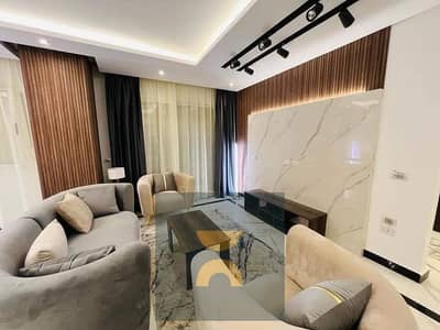 استثمار مضمون و عائد بالدولار اغتنم الفرصه و امتلك شقه تشطيب فندقى بالتكيفات و المطبخ فيو جاردن ع ش الثوره موقع حيوى فالورى شيراتون دقائق من الرحاب