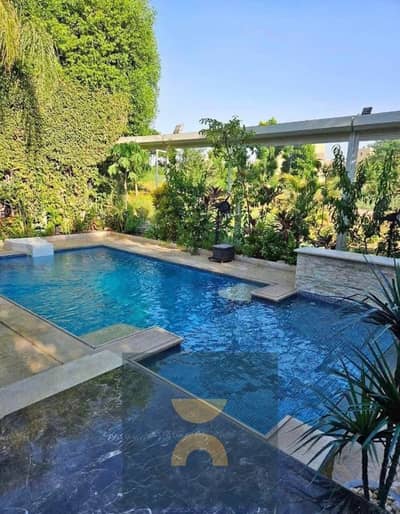 Standalone villa with a pool, fully finished, with installments over 10 years, interest-free, and a 50% discount on its price, directly on the Suez Ro