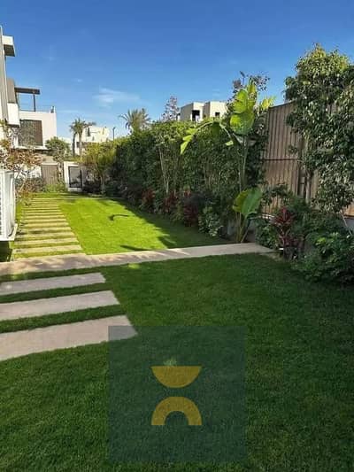 Ground floor 318 sqm apartment with private garden and open greenery view instant discount on Suez Road near AUC The Spine Towers Madinaty