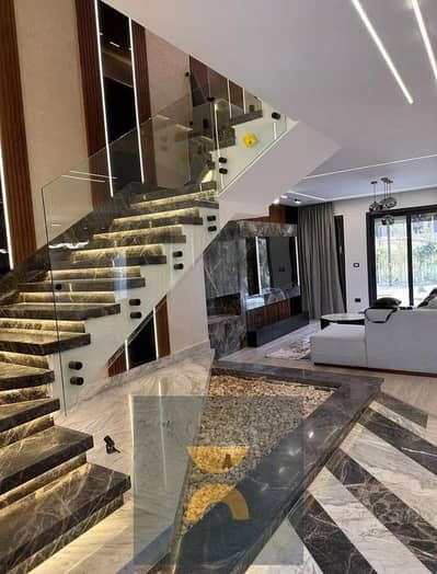 Three story villa at first launch prices prime location with open landscape view for sale in Fifth Settlement near AUC Mountain View and Madinaty