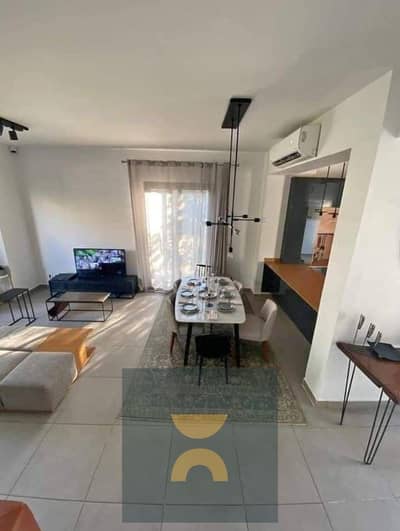 Twobedroom apartment with double view and prime location for sale in installments over 12 years directly on the Suez Road next to Madinaty opposit