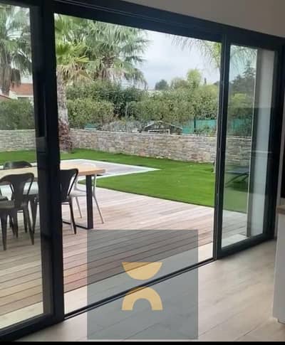 Own a villa with 12-year installments facing the largest landscape plot in a compound connecting Fifth Settlement and Mostakbal City near Privado