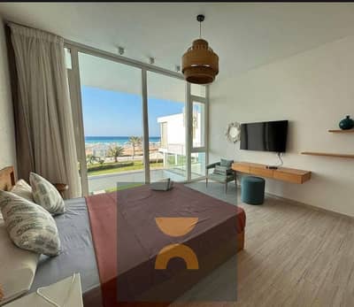 في شالية صف اول lagoon & seaview بموقع بانورامي fully finished + ACs مميز وبخصم 35 % من سعر للبيع في الساحل الشمالي بالقرب مراسي و مدن و ذا مد و سيزن