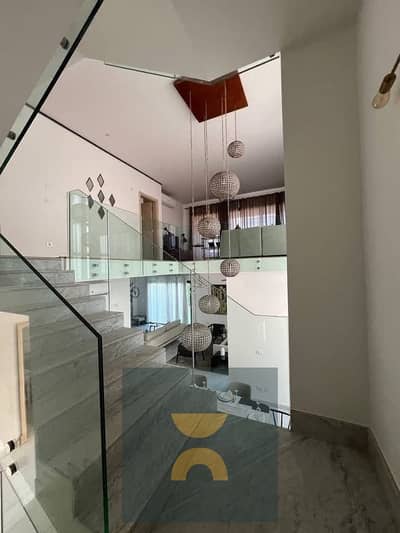 Standalone villa with 5 bedrooms private pool fully finished panoramic view 15 year installments directly on Suez Road near SODIC East El Burooj and L